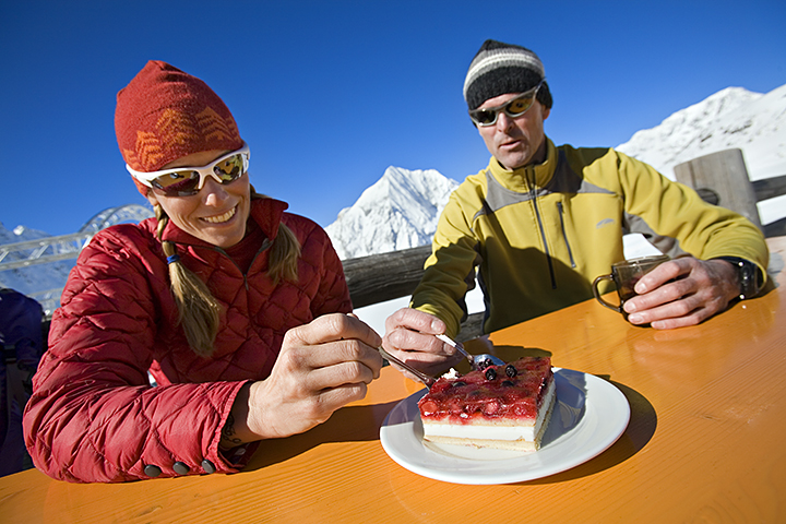 Couple relaxing on hut deck