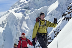 Three ski tourers on glacier