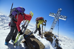 Couple on summit of ski peak in Alps