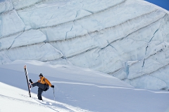 Man skiing beneath serac